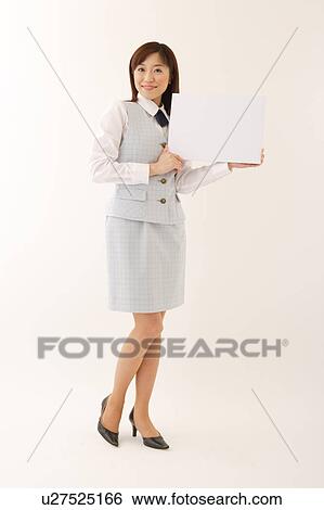 A woman in formal attire holding a white blank message View Large Photo Image Stock Photograph - A woman in formal attire holding a white blank message. Fotosearch