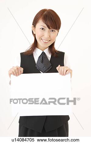 A woman in formal attire holding a blank message View Large Photo Image Stock Photography - A woman in formal attire holding a blank message. Fotosearch