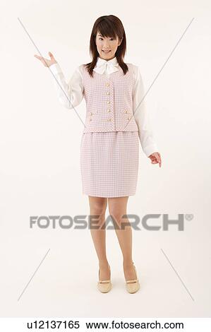 A woman in formal attire pointing a direction View Large Photo Image Stock Photography - A woman in formal attire pointing a direction. Fotosearch
