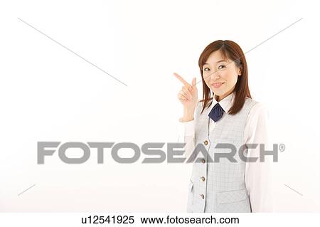 A woman in formal attire pointing a direction View Large Photo Image Stock Photography - A woman in formal attire pointing a direction. Fotosearch