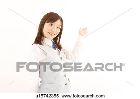 A woman in formal attire pointing a direction View Large Photo Image Stock Photography - A woman in formal attire pointing a direction. Fotosearch