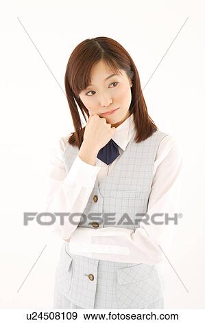 A woman in formal attire pondering View Large Photo Image Stock Photo - A woman in formal attire pondering. Fotosearch