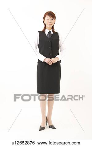 A woman in formal attire posing View Large Photo Image Stock Photograph - A woman in formal attire posing. Fotosearch