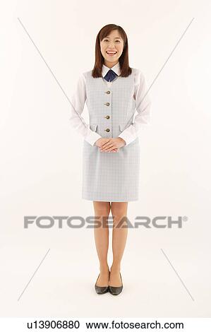 A woman in formal attire smiling View Large Photo Image Stock Image - A woman in formal attire smiling. Fotosearch
