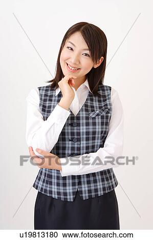 A woman in formal attire smiling View Large Photo Image Stock Image - A woman in formal attire smiling. Fotosearch