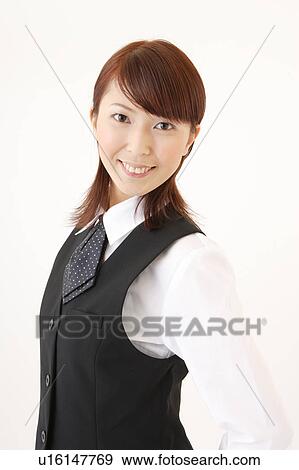 Stock Photo - A woman in formal attire smiling. Fotosearch
