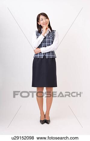 A woman in formal attire wondering View Large Photo Image Stock Photo - A woman in formal attire wondering. Fotosearch