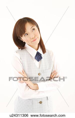 Stock Photograph - A woman in formal attire wondering. Fotosearch