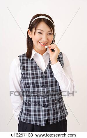 A woman with headset smiling View Large Photo Image Stock Image - A woman with headset smiling. Fotosearch