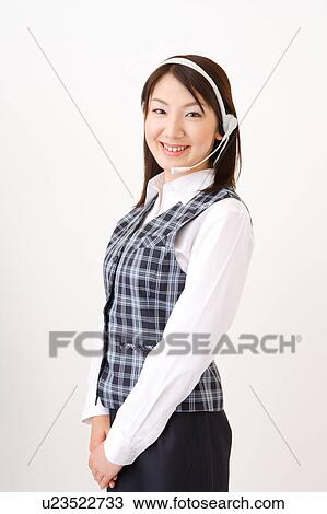 A woman with headset smiling View Large Photo Image Stock Image - A woman with headset smiling. Fotosearch