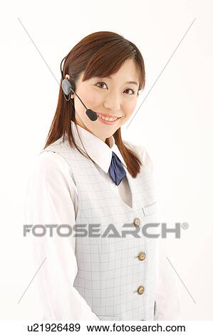 A woman with headset smiling View Large Photo Image Stock Photo - A woman with headset smiling. Fotosearch