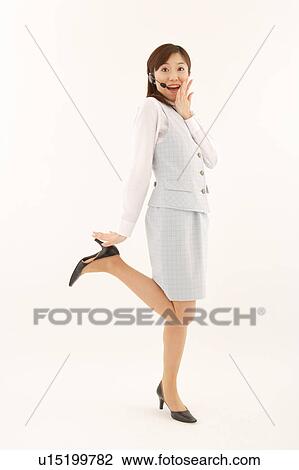 Stock Image - A woman with headset surprising. Fotosearch
