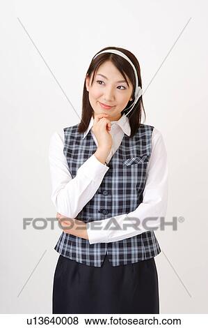 Stock Photo - A woman with headset wondering. Fotosearch