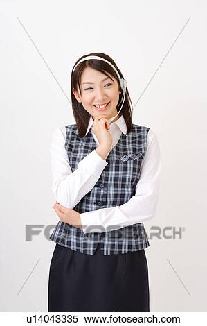 A woman with headset wondering View Large Photo Image Stock Photography - A woman with headset wondering. Fotosearch