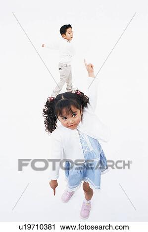 A boy and a girl dancing View Large Photo Image Stock Image - A boy and a girl dancing. Fotosearch