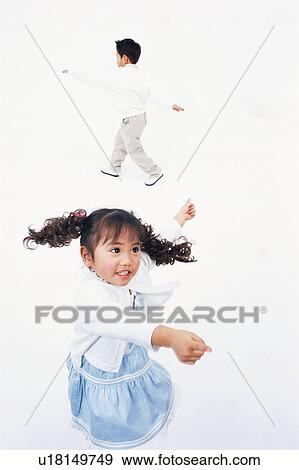 Stock Photo - A boy and a girl dancing. Fotosearch