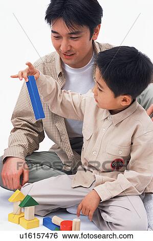 A father playing with his son View Large Photo Image Stock Photograph - A father playing with his son. Fotosearch