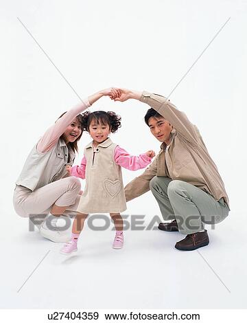 Stock Photo - A girl playing with her parents. Fotosearch