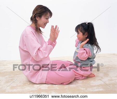 A mother playing with her daughter View Large Photo Image Stock Image - A mother playing with her daughter. Fotosearch