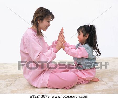 A mother playing with her daughter View Large Photo Image Stock Image - A mother playing with her daughter. Fotosearch