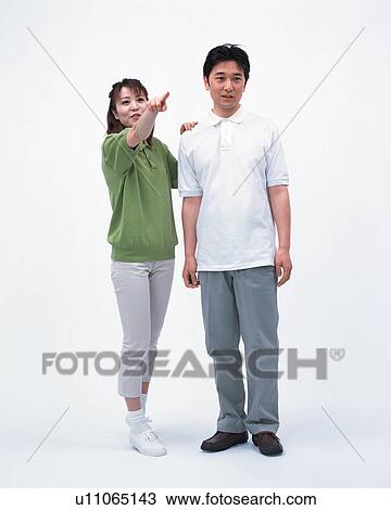 Stock Image - A woman drawing her husband's attention. Fotosearch