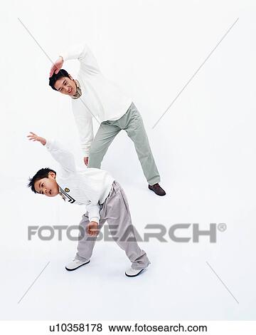 Stock Photo - Father and son stretching. Fotosearch