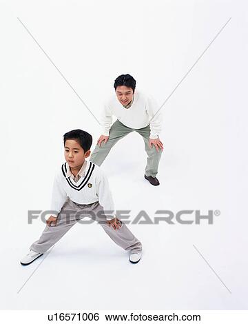 Stock Photograph - Father and son stretching. Fotosearch