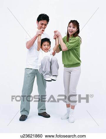 Stock Image - Parents lifting their son. Fotosearch