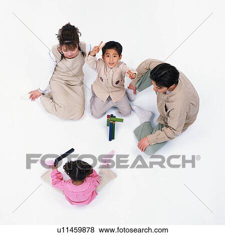 Stock Photo - Parents playing with their children. Fotosearch
