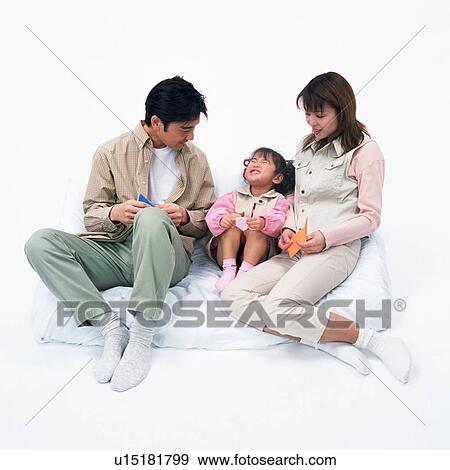 Parents playing with their daughter View Large Photo Image Stock Photo - Parents playing with their daughter . Fotosearch