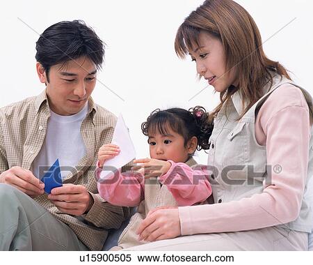 Parents playing with their daughter View Large Photo Image Stock Photography - Parents playing with their daughter . Fotosearch