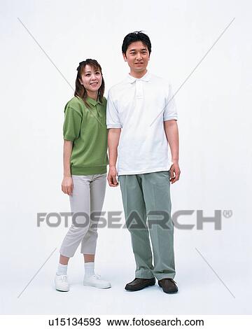 Portrait of a couple posing in front of a camera View Large Photo Image Stock Image - Portrait of a couple posing in front of a camera. Fotosearch