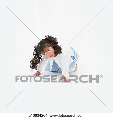 Picture - Portrait of a small girl with curly pigtails. Fotosearch