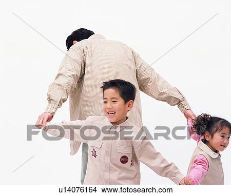Two children playing with their father View Large Photo Image Picture - Two children playing with their father. Fotosearch