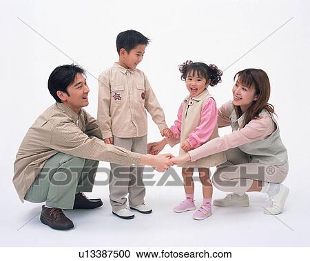 Two children playing with their parents View Large Photo Image Stock Image - Two children playing with their parents. Fotosearch