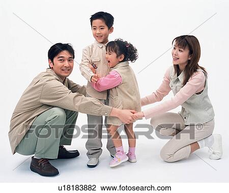 Two children playing with their parents View Large Photo Image Stock Image - Two children playing with their parents. Fotosearch