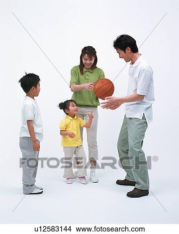 A family playing with a basketball View Large Photo Image Picture - A family playing with a basketball. Fotosearch