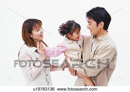 A father carrying a daughter and a mother watching View Large Photo Image Stock Photograph - A father carrying a daughter and a mother watching. Fotosearch