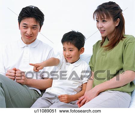 A small boy drawing attention of his parents by pointing his finger at one direction View Large Photo Image Stock Image - A small boy drawing attention of his parents by pointing his finger at one direction. Fotosearch