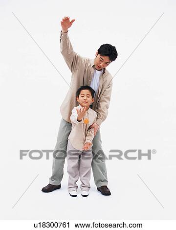 A small boy playing with cube with his father View Large Photo Image Stock Image - A small boy playing with cube with his father. Fotosearch