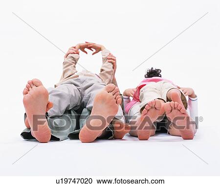 Children lying over their parents View Large Photo Image Stock Image - Children lying over their parents. Fotosearch