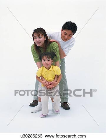 Front view of a small girl with her parents View Large Photo Image Stock Image - Front view of a small girl with her parents. Fotosearch