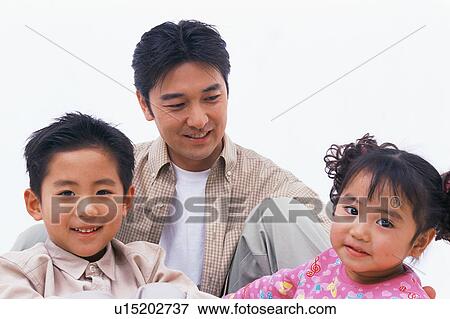 Stock Photo - Portrait of a man with his two children. Fotosearch