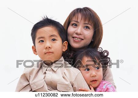 Portrait of a woman along with her two children View Large Photo Image Stock Image - Portrait of a woman along with her two children. Fotosearch
