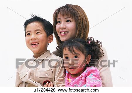 Portrait of a woman along with her two children View Large Photo Image Stock Photo - Portrait of a woman along with her two children. Fotosearch