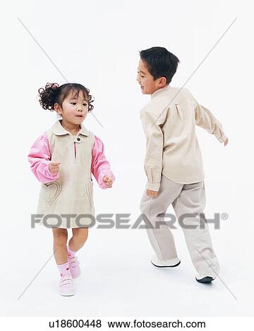 Stock Photo - Two children playing together. Fotosearch