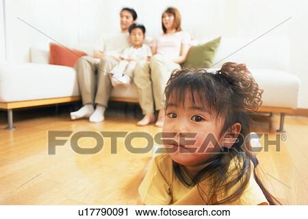 A cute girl lying on floor and looking at camera View Large Photo Image Stock Image - A cute girl lying on floor and looking at camera. Fotosearch