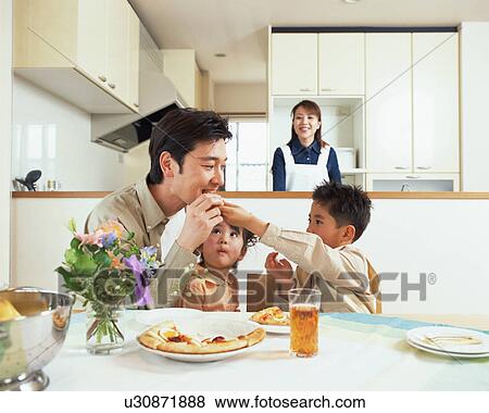 A man having a bite of pizza View Large Photo Image Stock Photo - A man having a bite of pizza. Fotosearch