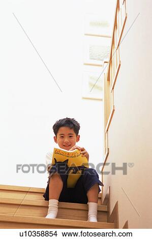 A small boy sitting on steps View Large Photo Image Picture - A small boy sitting on steps. Fotosearch