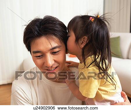 A small girl whispering to her father View Large Photo Image Stock Photograph - A small girl whispering to her father. Fotosearch